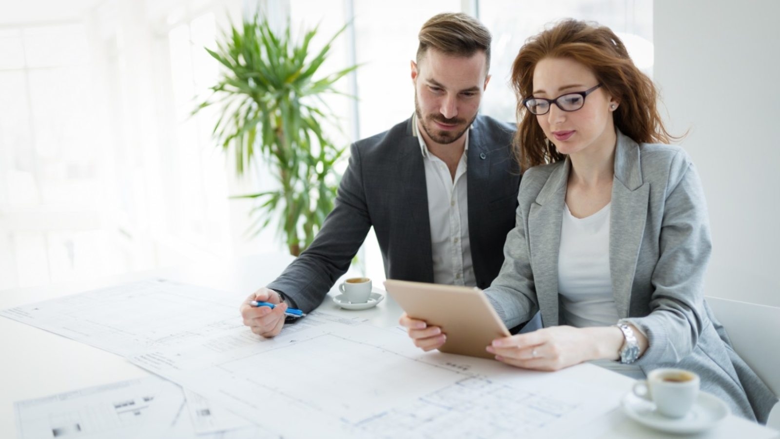 portrait-of-young-architect-woman-on-meeting-KFZCE3A-1600x900
